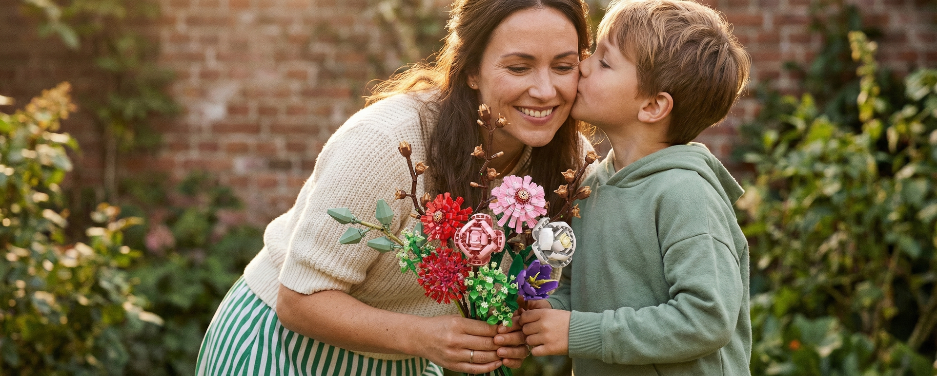 A tender moment where a young boy kisses his mother’s cheek as she holds a colorful Mavirea building block bouquet, illustrating the beauty of giving an eternal gift.