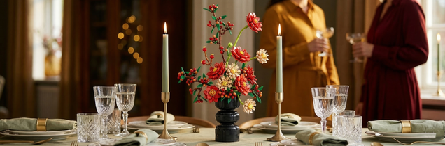 A Mavirea floral building block arrangement used as a centerpiece for a formal dinner, adding a touch of eternal elegance and warmth to a candlelit family gathering.