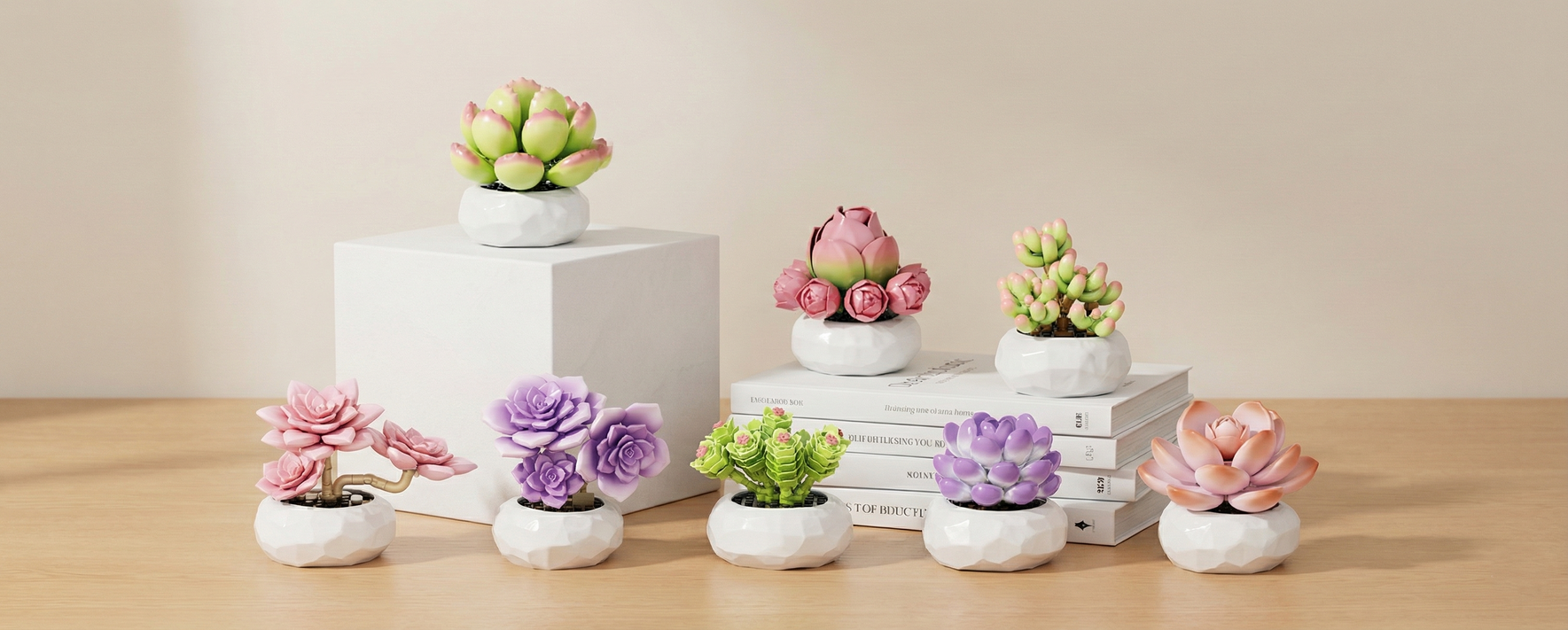 A variety of colorful Mavirea succulent building blocks displayed on white pedestals, serving as a low-maintenance and charming gift for office desks or small apartments.
