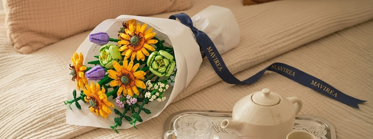 A beautifully wrapped Mavirea sunflower building block bouquet with a signature blue ribbon, resting on a bed tray as a perfect romantic and "everlasting" gift.