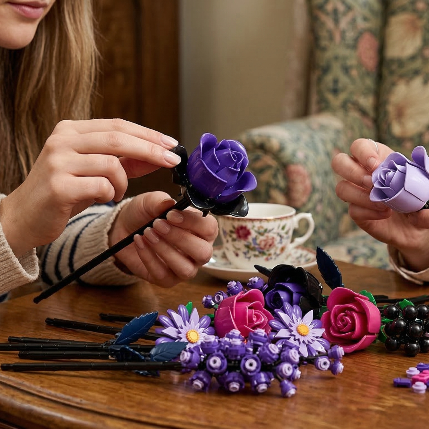 Hands carefully assembling Mavirea purple building block roses, showcasing the rich colors and intricate petal details of these creative, eternal floral gifts.