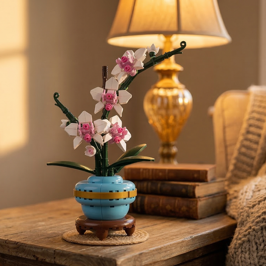A building block orchid by Mavirea displayed next to vintage books under warm lamp light, illustrating a timeless and maintenance-free decorative gift.