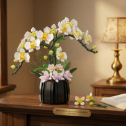 Mavirea's White Orchid Potted Plant building block set displayed with a botanical nameplate, an elegant eternal floral gift for home decor.