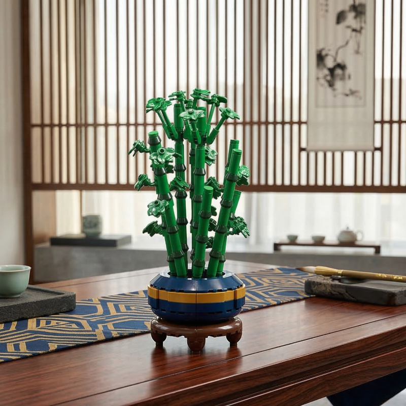 A Mavirea Gourd Bamboo Bonsai building set displayed on a traditional wooden tea table with a geometric blue runner, showcasing a Zen-inspired home decor aesthetic with its vibrant green stems and blue-yellow base.
