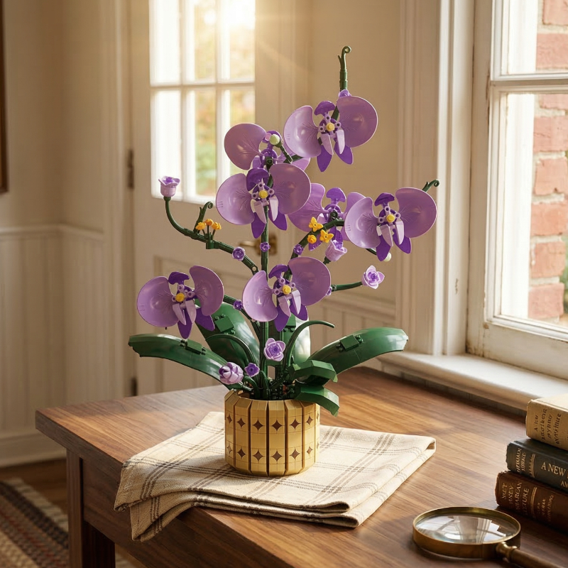 A detailed shot of the Mavirea Potted Moth Orchid building toy resting on a checkered cloth by a window, accompanied by a magnifying glass and stacked books to highlight its intricate design and home styling potential.