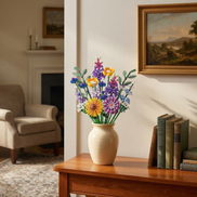 A vibrant Mavirea Hoshino Hana Collection building block bouquet, featuring a golden sunflower and purple hyacinths, displayed in a cream ceramic vase on a wooden console table in a classic, sunlit living room.