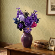 The Mavirea Purple Rose Whisper brick-built flowers displayed in a glossy purple ceramic vase, creating an elegant antique vibe on a wooden desk next to old books and a framed vintage portrait.