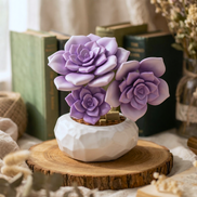 Close-up of purple Mavirea's building block Succulent on a rustic wooden slice coaster, highlighting detailed craftsmanship for nature-inspired decor.