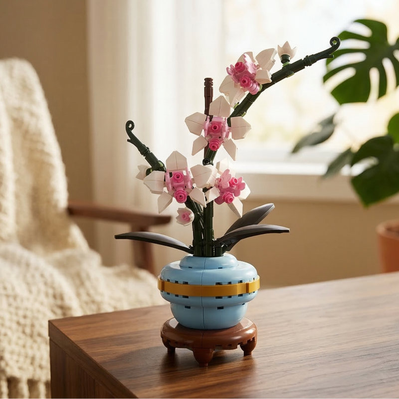 A Mavirea Orchid Potted Plant building block set in a blue and gold vase, adding a touch of modern elegance to a minimalist living room corner.