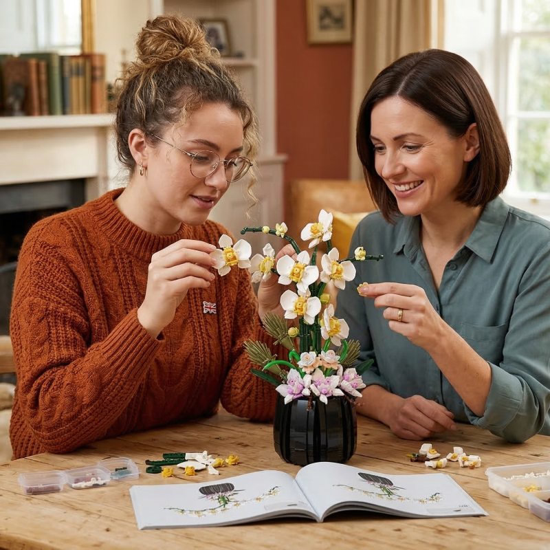Two women happily assembling the Mavirea White Orchid building block set together, showcasing the joy of interactive DIY gifting and home decor.